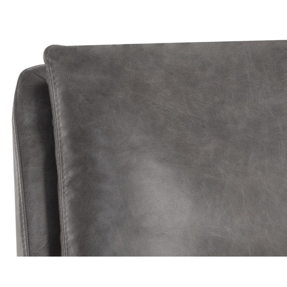 Fauteuil Cardina avec son assise en cuir gris foncé soutenue par un pied pivotant pour style MidCentury et un design  contemporain et masculin par Maillé Style (Érik Maillé)