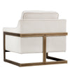 La chaise crème Céline est un fauteuil d'appoint en tissu doux blanc cassé avec une structure visible bronze rustique pour un design contemporain et confortable par Maillé Style (Érik Maillé)