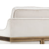 La chaise crème Céline est un fauteuil d'appoint en tissu doux blanc cassé avec une structure visible bronze rustique pour un design contemporain et confortable par Maillé Style (Érik Maillé)