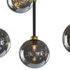 Luminaire suspendu Dino, chandelier moderne et impressionnant avec seize boules de verre gris fumé retenues par une structure de métal noir avec des accents dorés, par Maillé Style (Érik Maillé)