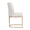 Chaise de salle à manger Ray, chaise élégante et légère avec son tissu crème et sa base arrondie en laiton dorée par Maillé Style (Érik Maillé)
